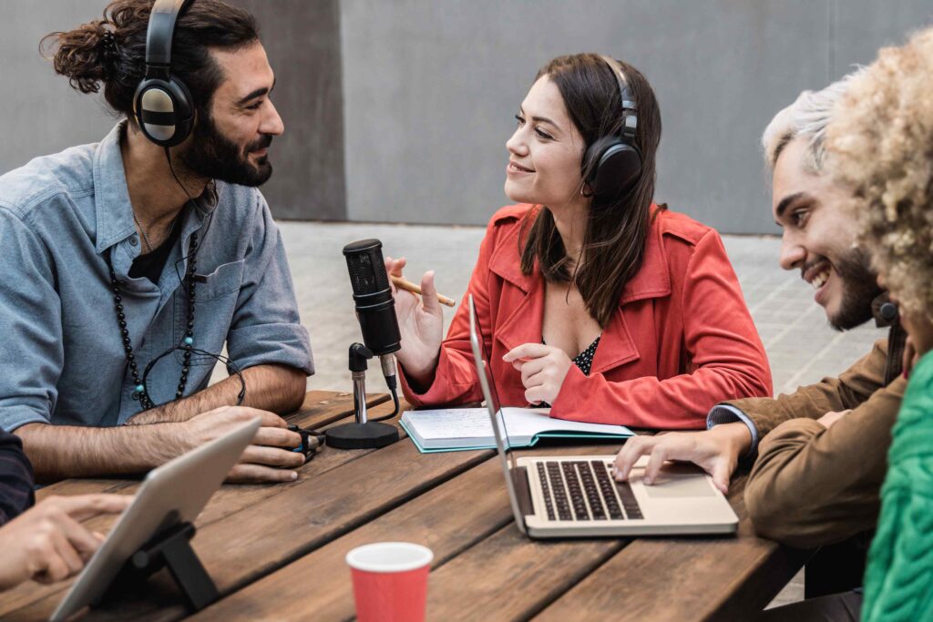 Group of people around a microphone